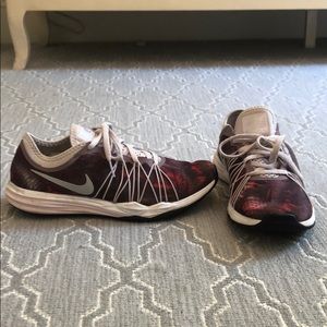 Pink and red Nike running shoes